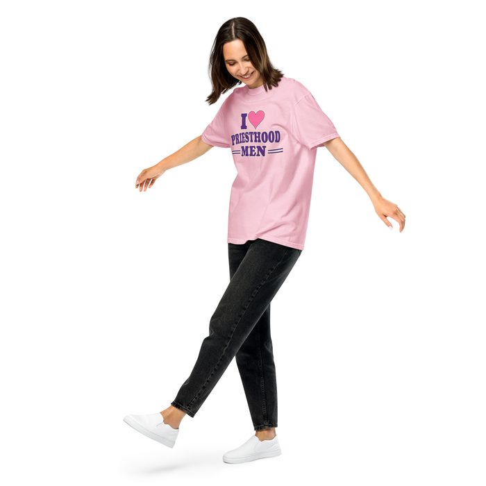 Woman walking in a pink I heart Priesthood Men tee