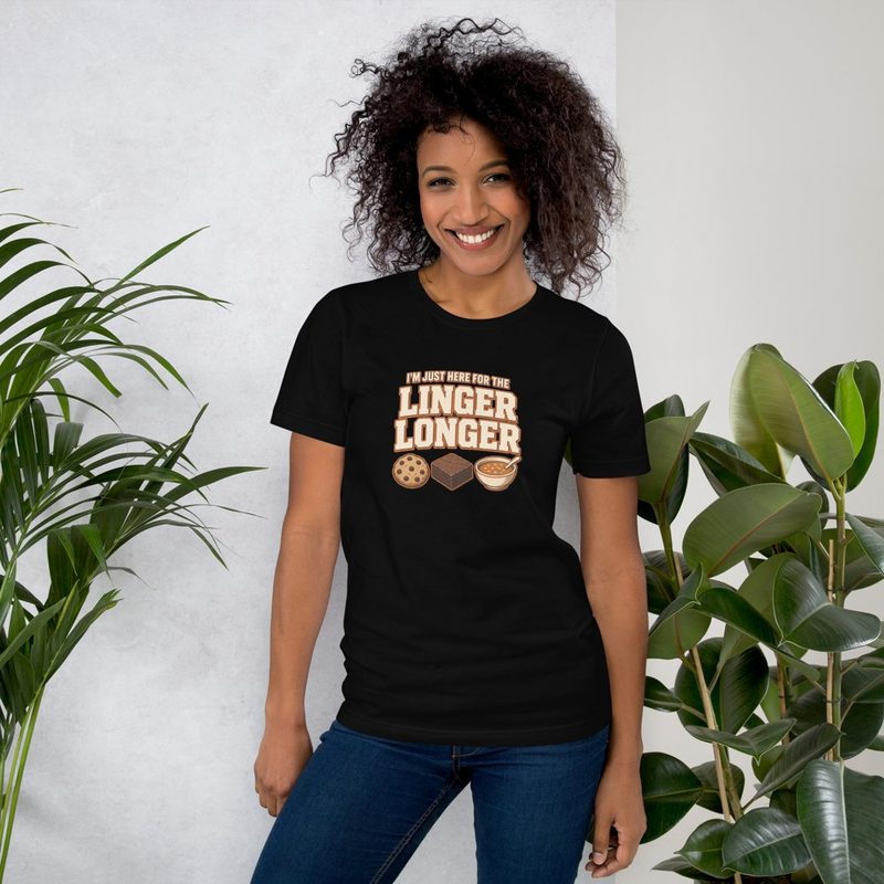 Smiling woman wearing a black tee that reads I'm Just Here For The Linger Longer
